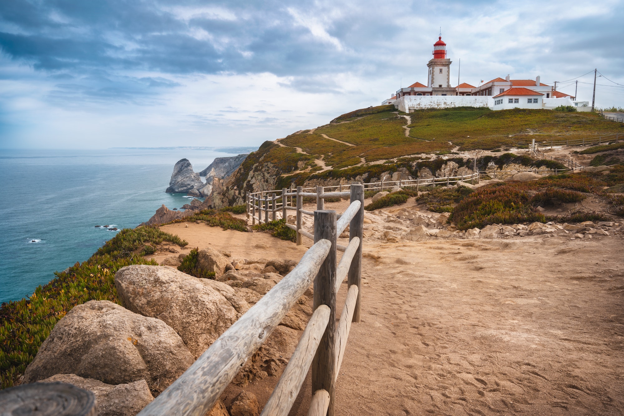 Sintra Portugal. Cape Roca and red lighthouse. Cabo da Roca. Travel and tourism landmark with